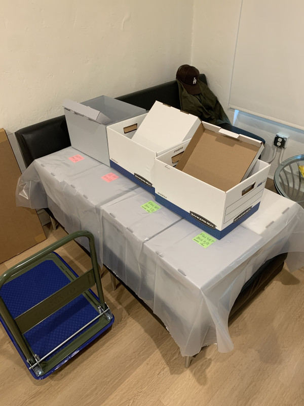 Packing boxes with complete runs of X-TRA for distribution to libraries, schools, nonprofits.